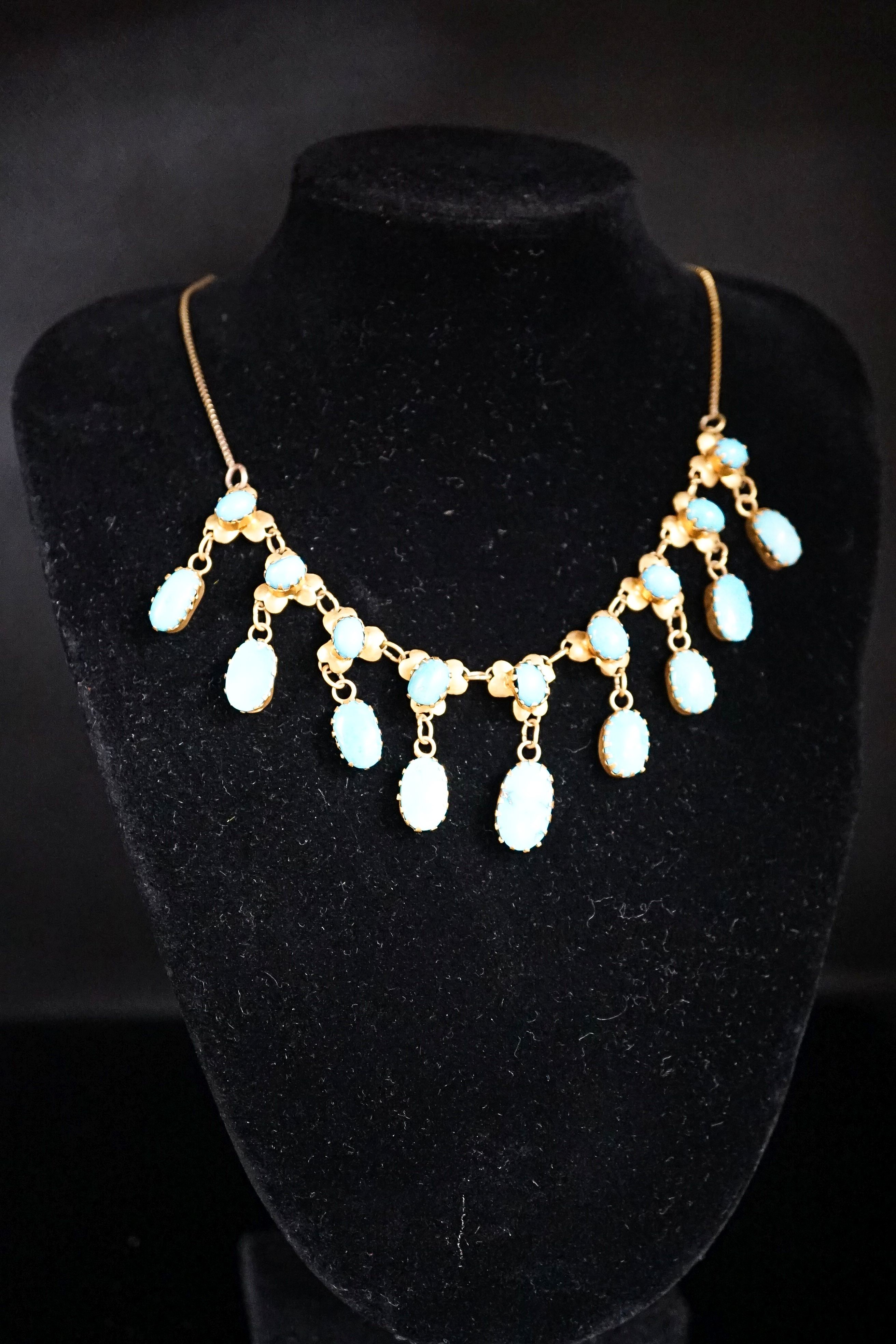 A 9k yellow metal and turquoise set drop fringe necklace, 43cm, gross 11.9 grams.